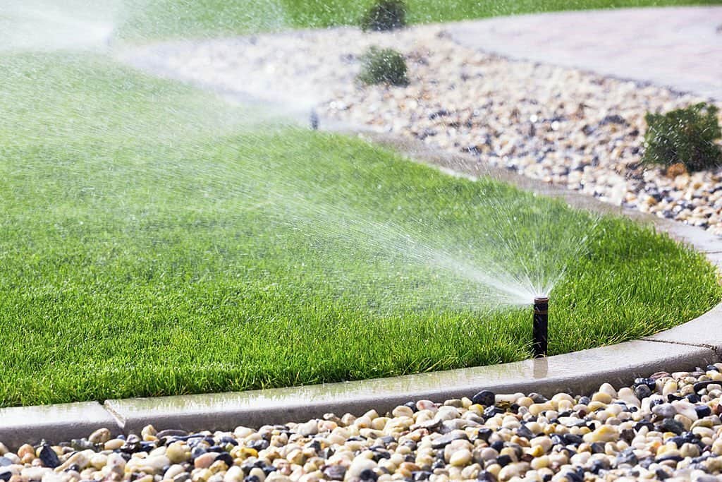 Automatic sprinklers watering lawn